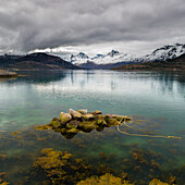 rocks in the waters of Sundsfjord, Nordland, Norway