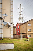 still-life of satellite dishes, power poles and colourful houses, Houston, Texas, US, United States of America, North America