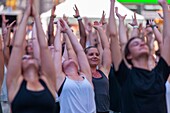 Thousands of yoga practitioners pack Times Square in New York to practice yoga on the first day of summer, Thursday, June 21, 2018. The 16th annual Solstice in Times Square, 'Mind Over Madness', sponsored by American Eagle Outfitters' athleisure brand Aer