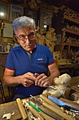 Jan Zieder, woodcarver in his workshop, village of Chocholow, Podhale region, Malopolska Province (Lesser Poland), Poland, Central Europe.