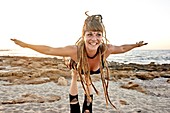 Yoga exercises in beach, Aerial Yoga, in holiday destination Chersonissos, Crete, Greece.