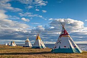 Canada, Quebec, Gaspe Peninsula, Gesgapegiag, Mic-Mac First Nations tee-pees by the Baie des Chaleurs.