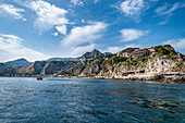 View from the water to the coast of Taormina, Sicily, south Italy, Italy