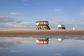 Pile dwellings on the beach in St. Peter-Ording, peninsula Eiderstedt, North Frisia, Schleswig-Holstein, Northern Germany, Germany, Europe