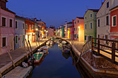 The typical colored houses with Rio di San Mauro Canal at dusk, Burano Island, Venice, Veneto, Italy.