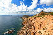 Capo Sandalo lighthouse from the cliff. San Pietro Island, Sud Sardegna province, Sardinia, Italy, Europe.