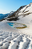 A small thaw lake under Sforzellina Peak. La valleta, Pejo valley, Trentino, Italy.