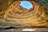 Giant beach cave with hole in the ceiling at Benagil, Algarve, Portugal