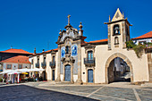 Church and gate with bell tower, Torre do Relógio at the Praça da República, Sao Joao de Pesqueira, Portugal