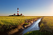 Priel through the salt marshes at the lighthouse Westerhever, North Sea, Schleswig-Holstein, Germany
