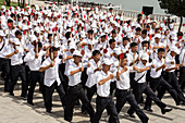 Kim Il Sung Square, hordes of young people rehearsing marching routines prior to a grand parade, Pyongyang, North Korea, Asia