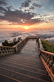 View of steps at Corcovado mountain above clouds at sunset, Rio de Janeiro, Brazil