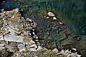 Backpackers hike to Twin Island Lakes near Mt Ritter while on a two-week trek of the Sierra High Route in the Minarets Wilderness, Inyo National Forest, California. The 200-mile route roughly parallels the popular John Muir Trail through the Sierra Nevada Range of California from Kings Canyon National Park to Yosemite National Park. 