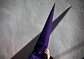 Penitent wearing pointed hood during Easter Week celebrations in Baeza, Jaen Province, Andalusia, Spain