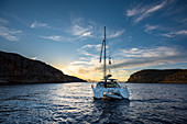 Catamaran in bay in Kalymnos, Greece at sunset