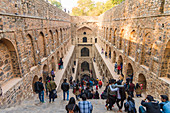 Groups of people at Agrasen ki Baoli, a historical step well on Hailey Road near Connaught Place, New Delhi, India, Asia