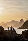 View over rocks of Piratininga towards Rio de Janeiro, sunset, Niteroi, State of Rio de Janeiro, Brazil, South America