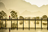 Mountains and bridge reflected in still lake, Hpa an, Kayin, Myanmar