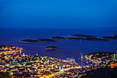 Aerial view of coastal town illuminated at night, Croatia
