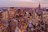 Aerial view of highrise buildings in cityscape at twilight, USA
