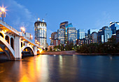 Centre Street Bridge and Calgary Skyline, dusk, a tall building under construction, Calgary, Alberta, Canada