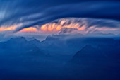 Clouds move over Col Nudo and Monte Teverone, Monte Serva, Schiara, Bellunesian Dolomites National Park, Dolomites, UNESCO World Heritage Dolomites, Veneto, Italy