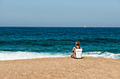 Woman on deserted beach, Roccapina, near Sartène, Corse-du-Sud department, Corsica, France