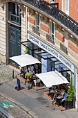 France, Paris, the city view from the heights of Montmartre, rue Lepic, Jeanne B restaurant and its terrace on the sidewalk