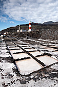 View of the salt flats, in the background the lighthouse of Fuencaliente, La Palma, Canary Islands, Spain, Europe