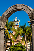Our Lady of Guadalupe church through the Malecon arches, Puerto Vallarta, Jalisco, Mexico, North America