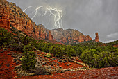 A lightning storm moving in across Lee Mountain just northeast of the Rabbit Ears formation in Sedona, Arizona, United States of America, North America