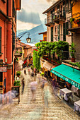 Tourists walk stairs in Bellagio, Province of Como, Lake Como, Italian Lakes, Lombardy, Italy, Europe