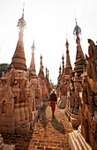 Kakku Pagoda Complex, tourist walks amongst more than 2000 pagodas, Shan state, Myanmar (Burma), Asia