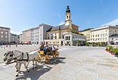 View of St. Michaelskirche and restaurants in Residenzplatz, Salzburg, Austria, Europe