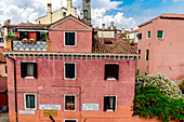 House with red facade, Venice, Italy