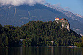 Bled Castle with Lake Bled and canoeists, Bled Slovenia