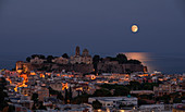 Full moon over the city of Lipari in the Aeolian Islands at night, Sicily Italy