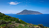 Lipari coastline with view of Salina volcanic island at day, Sicily Italy