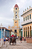 Street scene at Plaza Mayor with St. Francis Church in the background, Trinidad, UNESCO World Heritage Site, Cuba, West Indies, Caribbean, Central America