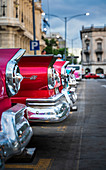 Colourful old American taxi cars parked in Havana at dusk, UNESCO World Heritage Site, La Habana, Cuba, West Indies, Caribbean, Central America