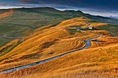 France, Savoie, Beaufortain, Hauteluce, view peaks and alpine meadows at sunset, under a cloudy sky