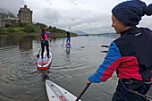 Stand up paddle boarding at Loch Duich, Eilean Donan Castle, Dornie, Highlands