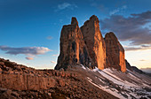 Illuminated Drei Zinnen from the north side of the Paternsattel at sunset, South Tyrol
