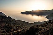 Girolata Bay, sunset over the Scandola Nature Reserve, Galeria, Calvi, Corsica, France.