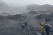 Ascent of Kilimanjaro on the Machame route; fourth stage between Barranco and Karanga Camp; Hikers in the rain