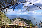 View of Taormina with sea, clouds, small town, east coast, Sicily, Italy