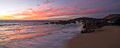 Yallingup, Australia - February 19, 2010: Waves from the ocean and sunset over the Wyadup Rocks.