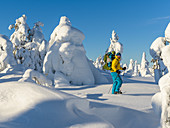Snowshoeing with a child in Pyhä-Luosto National Park, Finland