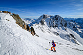 Woman on ski tour climbs to Upiakopf, Upiakopf, Matscher Valley, Ötztal Alps, South Tyrol, Italy
