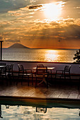 View of the Stromboli volcano with pool and sea in the foreground